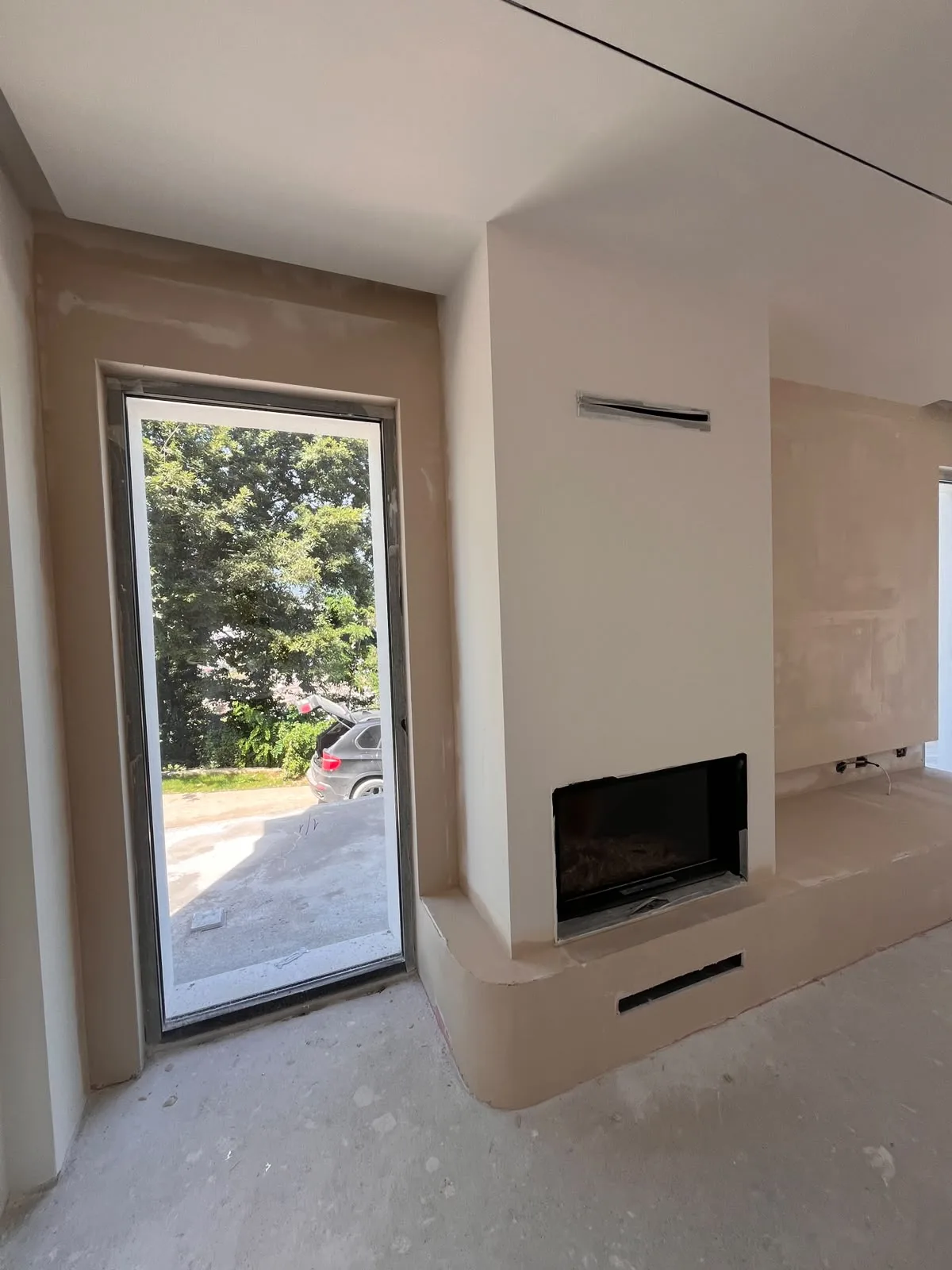 Gypsum TV wall with fireplace niche
