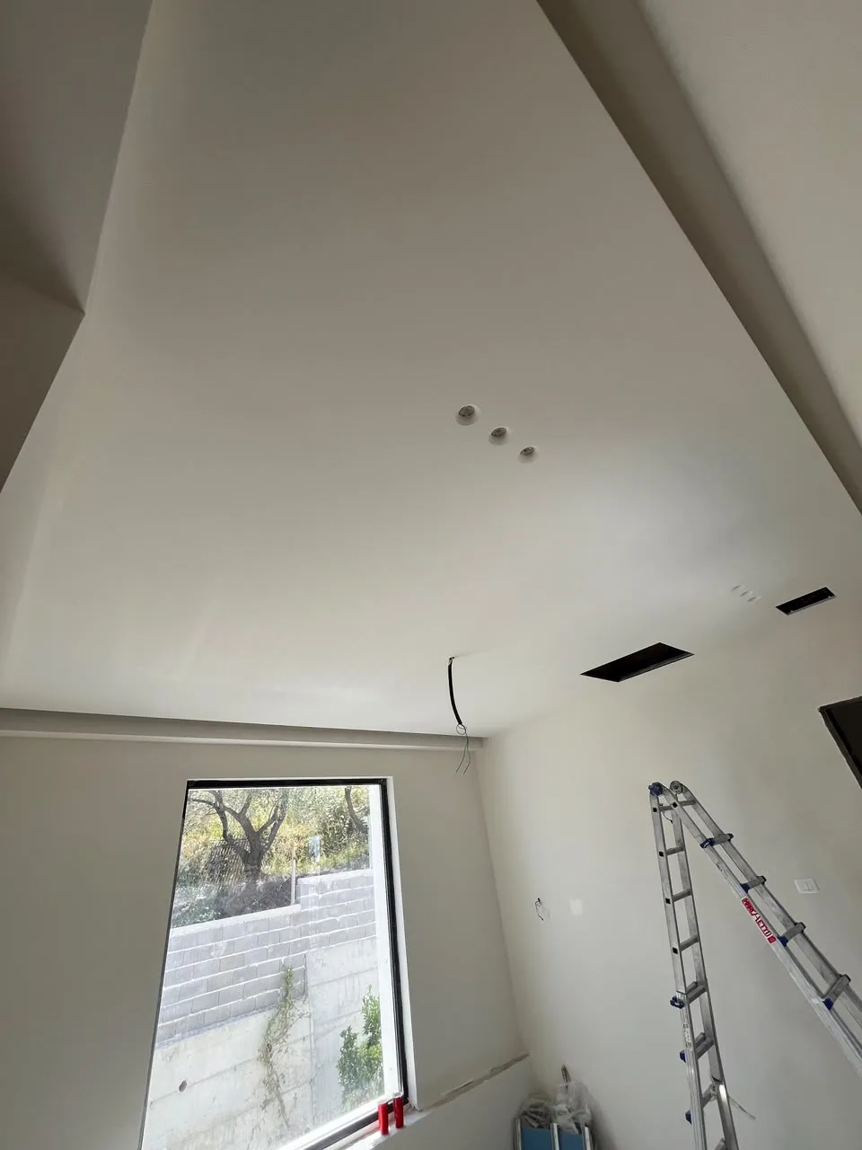 Gypsum ceiling for a living room with lighting