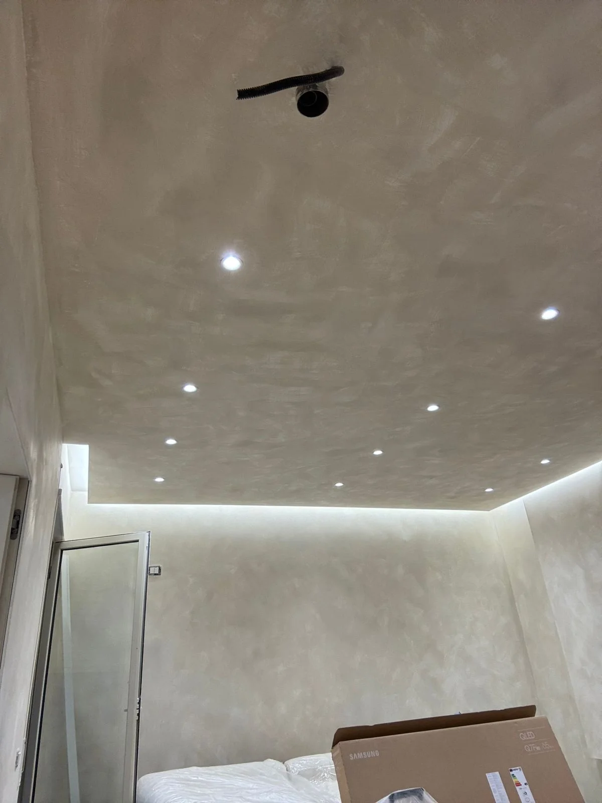 Layered cove LED lighting with spotlights, floating ceiling effect